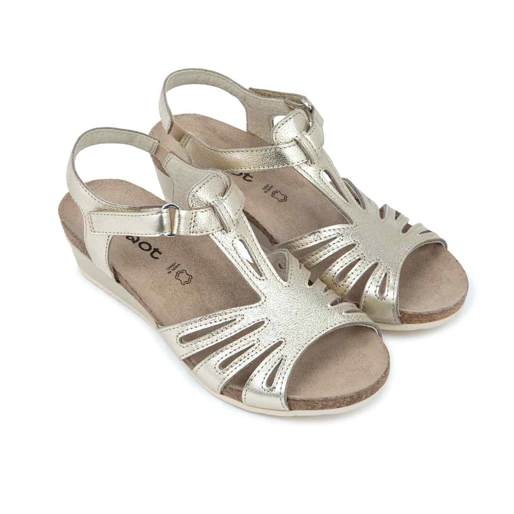 Dansko Starlet Leather Wedge Sandal, T-strap from the toe to adjustable ankle strap that wraps around the ankle, gold shine leather with glitter texture. Footbed is light brown cork and sole is light beige. | Side view | Simons Shoes