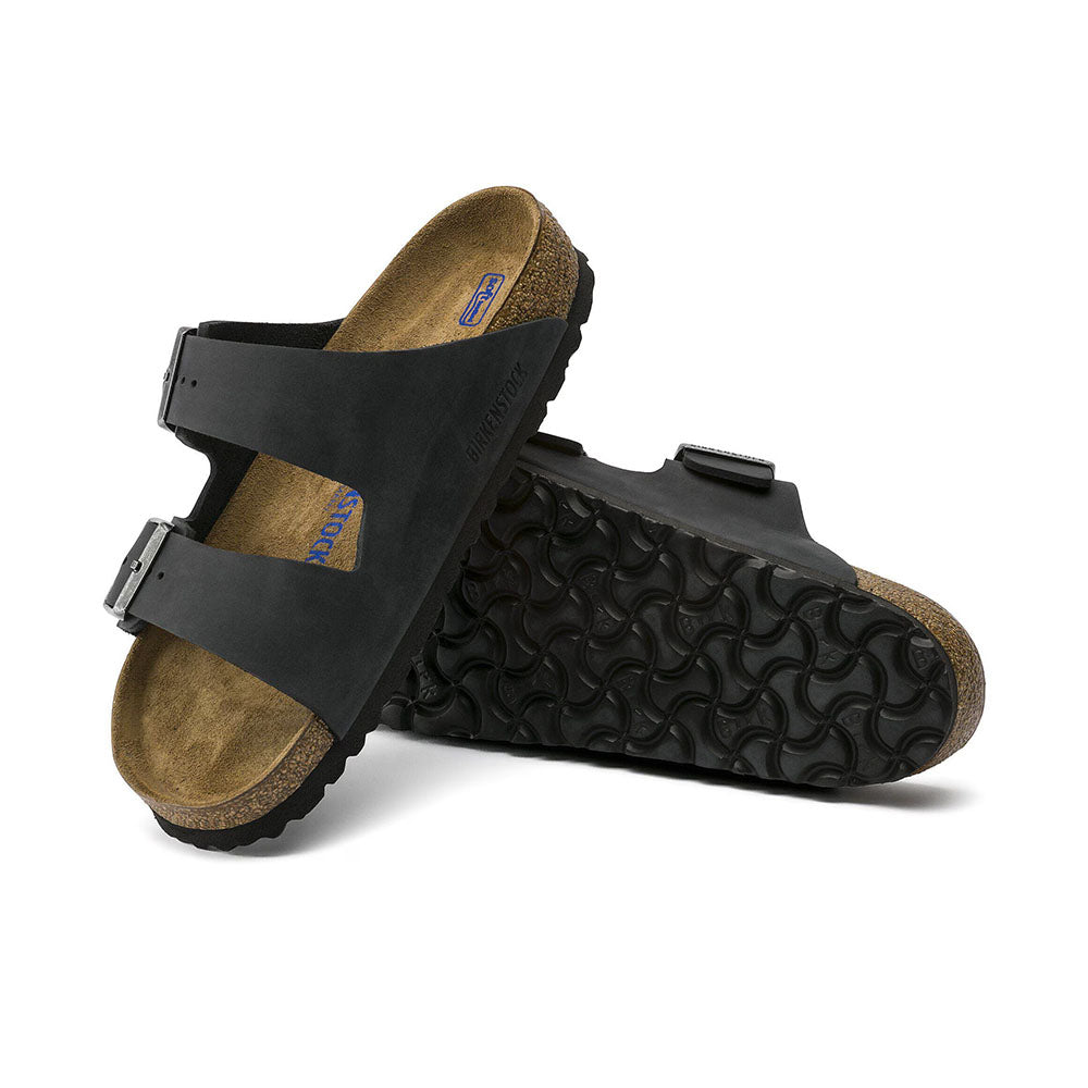 Birkenstock Arizona Soft Footbed Black Oiled Leather Two Strap Slip On Sandal Slide, light brown cork footbed with dark brown sole | Side view | Simons Shoes 