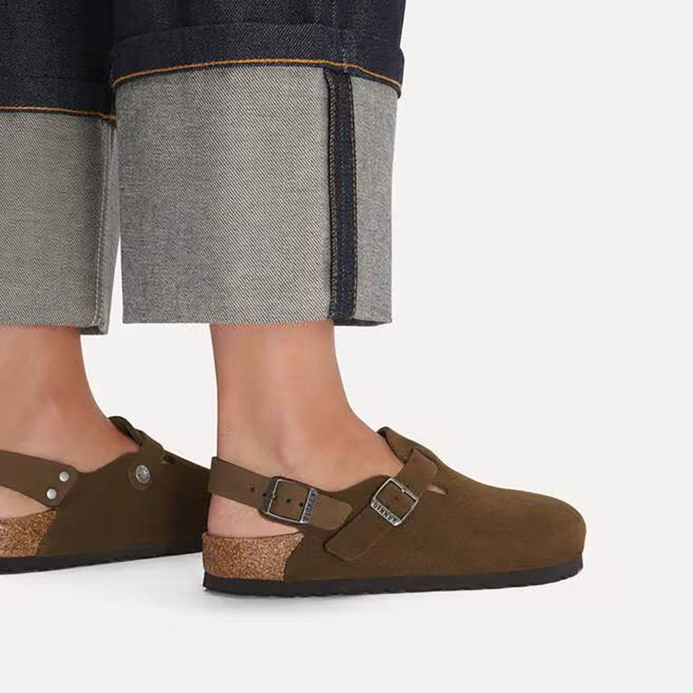 Birkenstock Tokio Carafe Brown Clog soft suede clog with ankle strap, silver buckle on top of clog and for ankle strap, black sole, person wearing them with no socks is this image | Simons Shoes