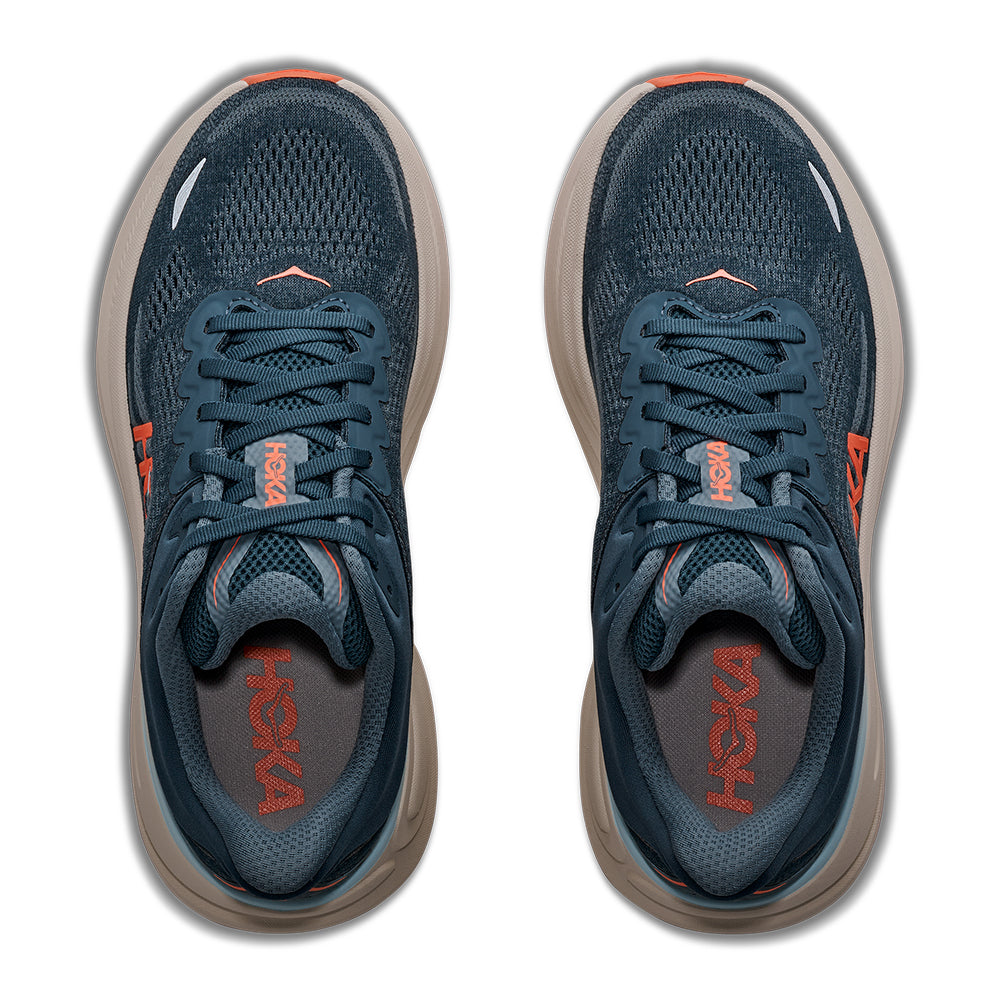 A HOKA Women's Bondi 9 running shoe in navy blue with a thick beige midsole and bright orange accents on the logo, tongue, and outsole, shown against a plain white background.